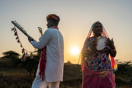 Rajasthani folklore musician and singer with ravanahatha and Khanjari Dafli instrument in Pushkar Rajasthan India