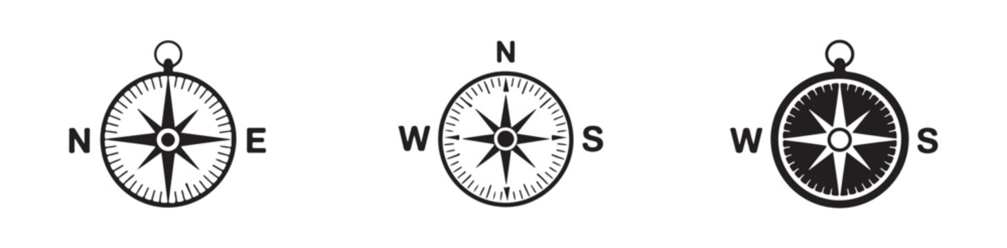 Collection of various compasses and wind rose symbols for direction and navigation.