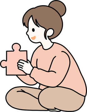 Woman holding a puzzle piece, problem solving concept