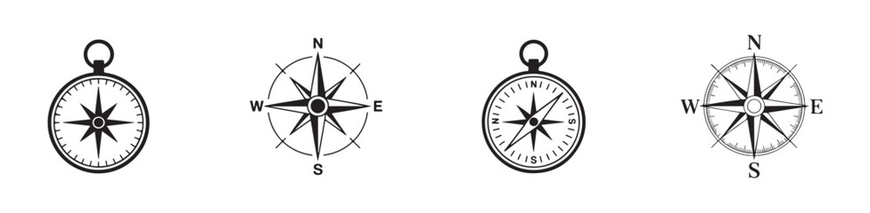 Group of compasses and wind roses showing directions for nautical journeys and vintage exploration themes. © Joynab