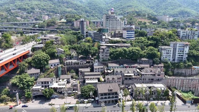 Aerial View of Hillside Town with Red Bridge in Chongqing, China