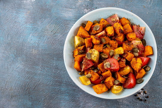 Roasted Pumpkin salad with tomato and pumpkin seeds