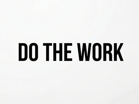 Inspirational quote sign with bold black typography reading DO THE WORK on a white background for motivation