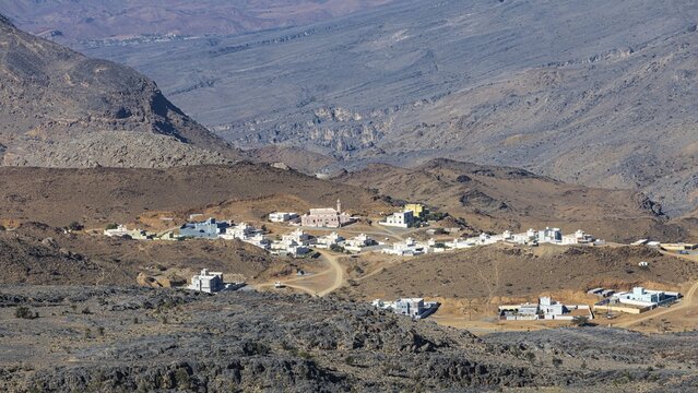 Newly built mountain village in a vegetation-free mountain landscape, Arabian Peninsula, Sultanate of Oman