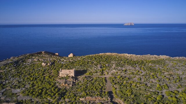 Drone shot, ruins on cliffs by the sea with sweeping views and lush vegetation to the horizon, Venetian sea fortress, Gramvoussa, Gramvoussa peninsula, Pirate Bay, Balos, lagoon, north-west Crete, Crete, Greek Islands, Greece
