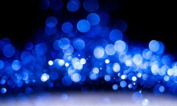 &bull; 
Blue Glitter Floating Over White Surface