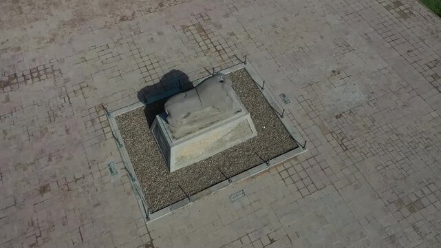 Top-down aerial view of an ancient stone plinth among the ruins of Babylon, Iraq