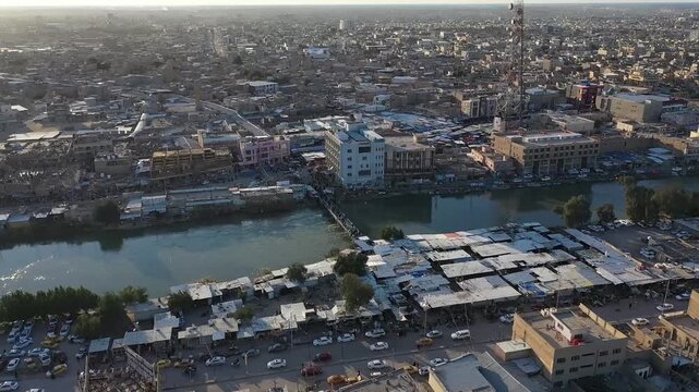Drone flyover of the city of Hilla along the Shatt al-Hilla river, Iraq