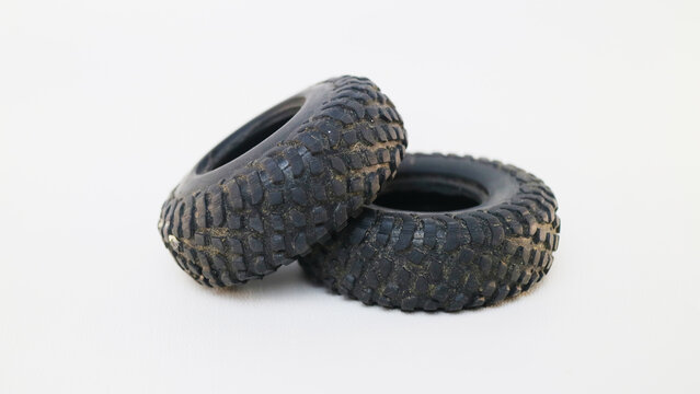 Two small offroad rubber tires for remote control car models isolated