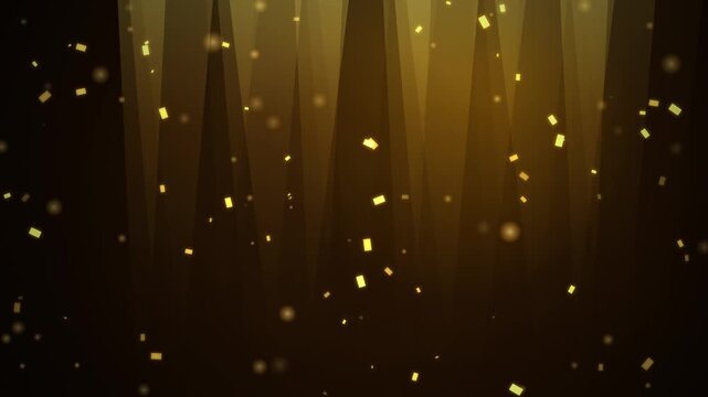 Golden confetti falling against dark background with stage light rays for luxury celebration.