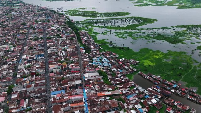 Tropical City Beside Flooded Wetlands Aerial View