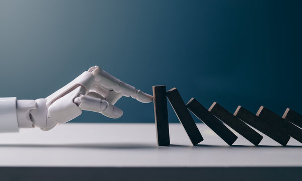 Robotic Hand Stopping Wooden Blocks Domino Effect for AI Risk Management Concept