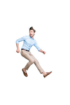 Happy, young, bearded, attractive handsome man in shirt, pants  jumping in air over grey background