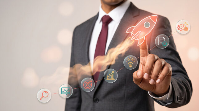 Executive businessman launching a virtual startup rocket projecting a trajectory of digital business strategy and innovation icons