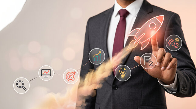 Corporate business acceleration and startup launch concept showing executive interacting with holographic rocket and strategic growth icons