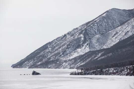 Frozen lake and snow forest