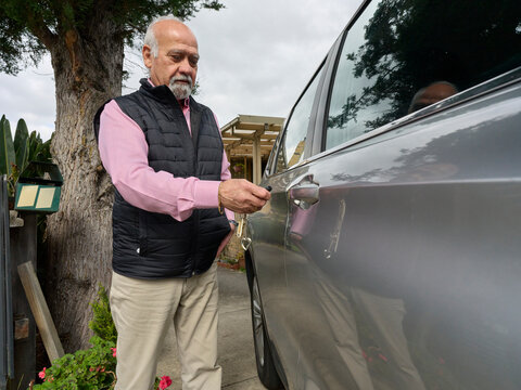 Man Unlocks Car Outside Home