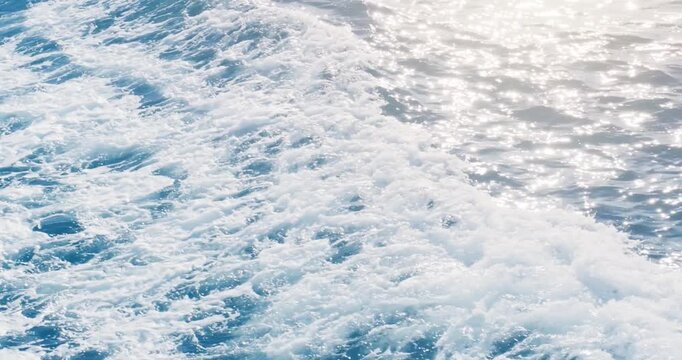 Ocean sea blue wave background. Surface of tropical empty wake of moving water in motion on sunny summer day.