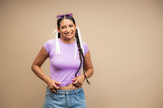Woman feeling self-conscious about body image pulling shirt