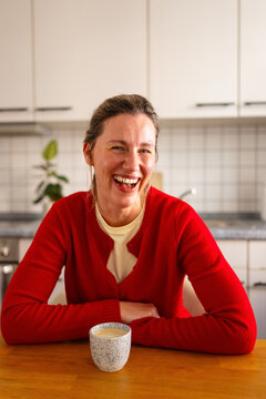 Cheerful woman with coffee