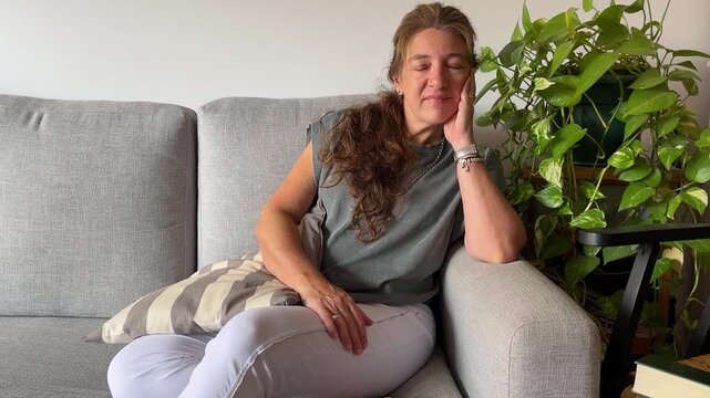 Female person enjoying a moment of peace and tranquility at home