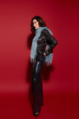 Obraz premium Winter glam vibes with a stylish woman in festive party attire