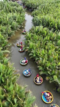Tourists Riding Round Basket Boats in Hoi An, Vietnam