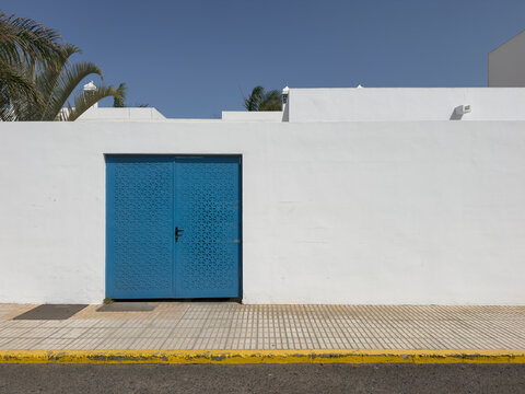 white wall and blue gate