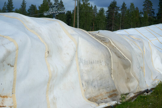 Manmade snow farming in insulation shroud - climate change adaptation