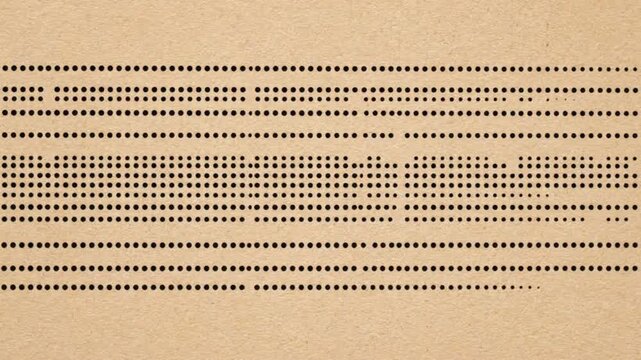 Vintage punch card with rows of punched holes representing old computer data storage.