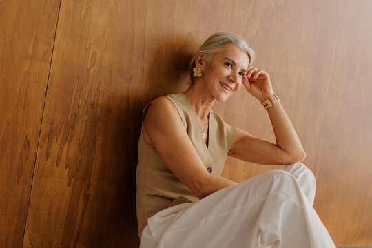 Senior woman smiling wearing elegant jewelry