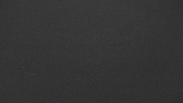 Vintage classic film grain overlay with dust scratch effect for mystery cinematic video editing