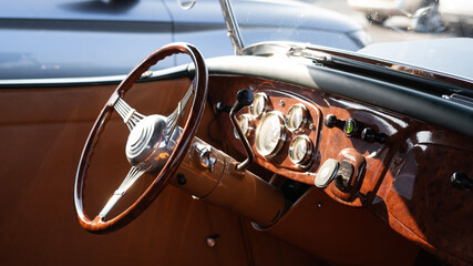 Vintage Classic Car Interior With Wooden Steering Wheel And Dashboard © Ruslan MN