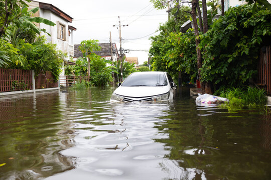 Cars submerged in water. Street after heavy rain. Disaster Motor Vehicle Insurance Claim, Severe weather