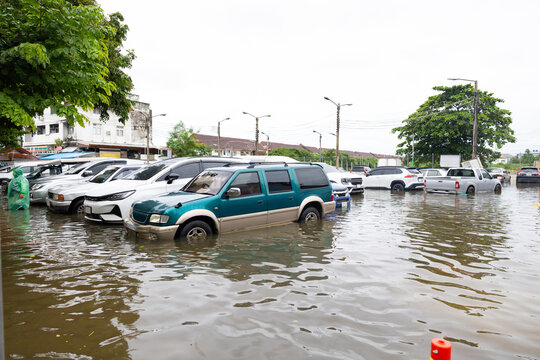 Cars submerged in water. Street after heavy rain. Disaster Motor Vehicle Insurance Claim, Severe weather