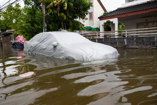 Cars submerged in water. Street after heavy rain. Disaster Motor Vehicle Insurance Claim, Severe weather