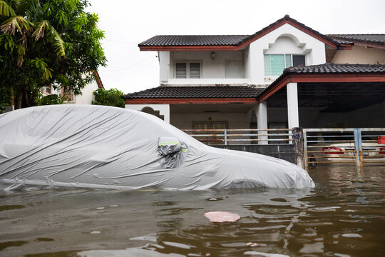 Cars submerged in water. Street after heavy rain. Disaster Motor Vehicle Insurance Claim, Severe weather