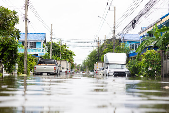 Cars submerged in water. Street after heavy rain. Disaster Motor Vehicle Insurance Claim, Severe weather