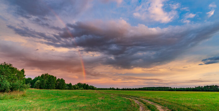 Vast field under dramatic twilight sky