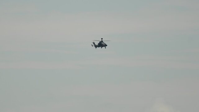 Military Eurocopter Tiger attack helicopter flying in the sky