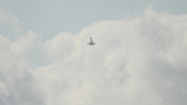 Eurofighter Typhoon military jet flying high in a cloudy sky