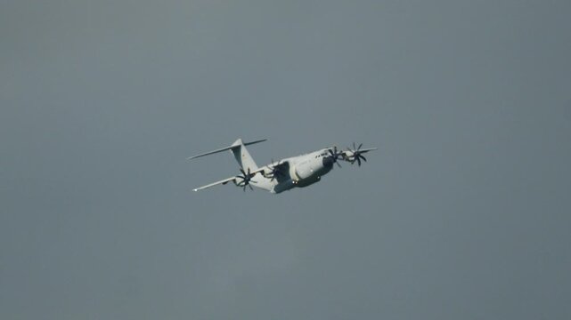 Military cargo Airbus A400M Atlas flying in a cloudy sky