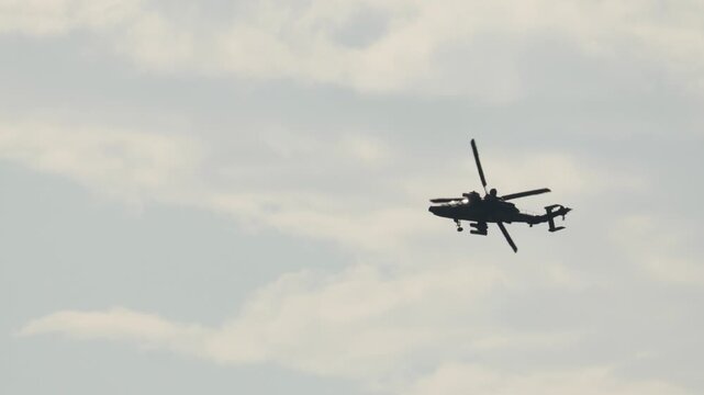 Military Eurocopter Tiger attack helicopter performing aerial acrobatics