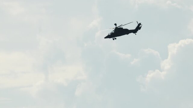 Military attack helicopter Eurocopter Tiger flying in the sky