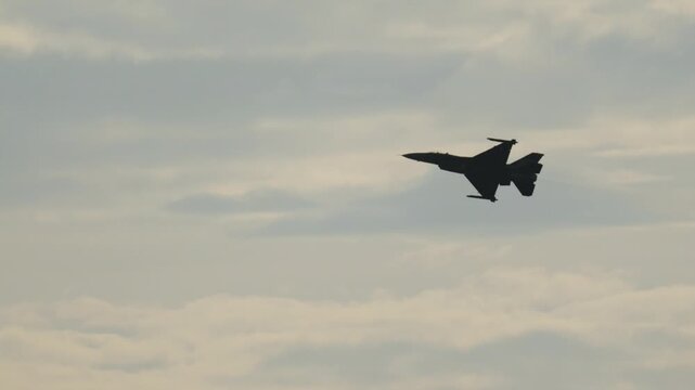 F16 Fighting Falcon jet performing a banking maneuver