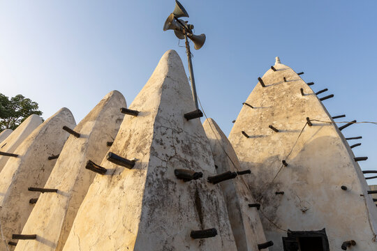 Mud mosque spires with loudspeaker, Larabanga, Ghana