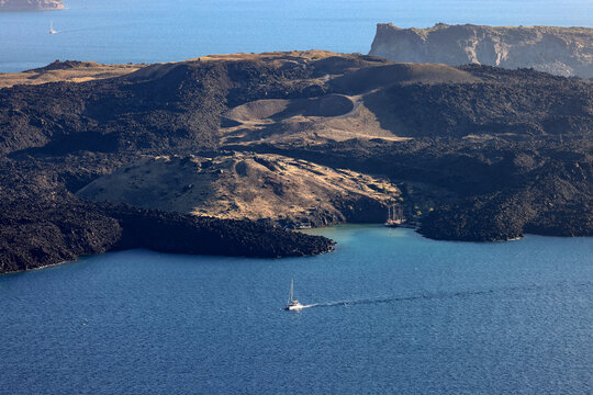 View from Santorini to volcanic island Nea Kamena, Cyclades, Greece