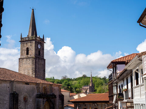 Historic Church Tower in Comillas Spain - Scenic view of the ancient Santa Maria de los Angeles church and traditional architecture in Comillas, Cantabria, Northern Spain.
