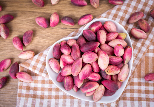 Fresh raw pistachio nuts in shell natural background. Fresh pistachios for sale at a street market. Turkish known as "Fistik or Antepfistigi"