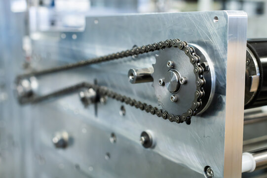 Industrial machinery with metal chain and sprocket drive system
